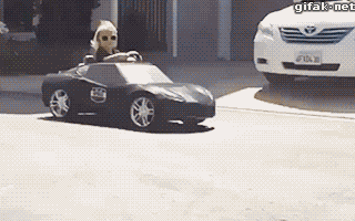 a kid doing a cool handbrake turn in a toy car
